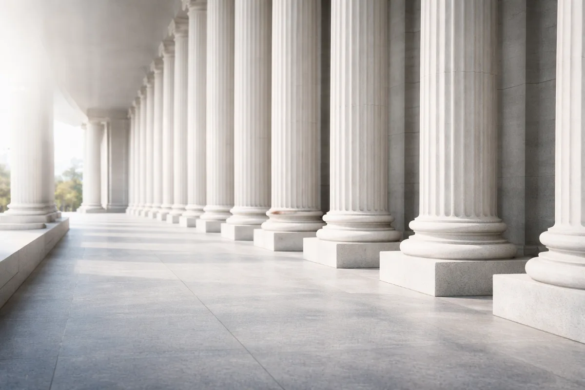 Stone courthouse columns in morning light
